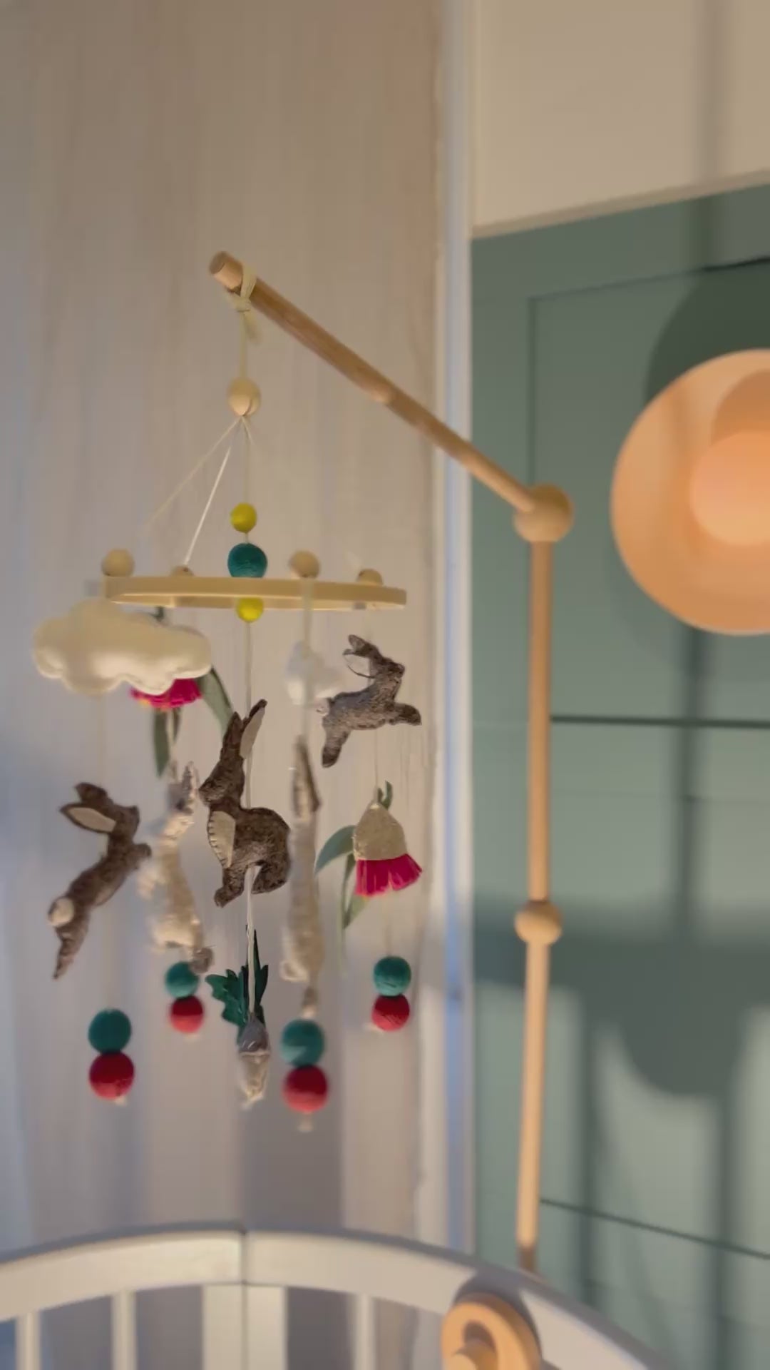 Pure wool felt nursery mobile with woodland bunnies and soft earthy colours, finished with a bamboo hoop.