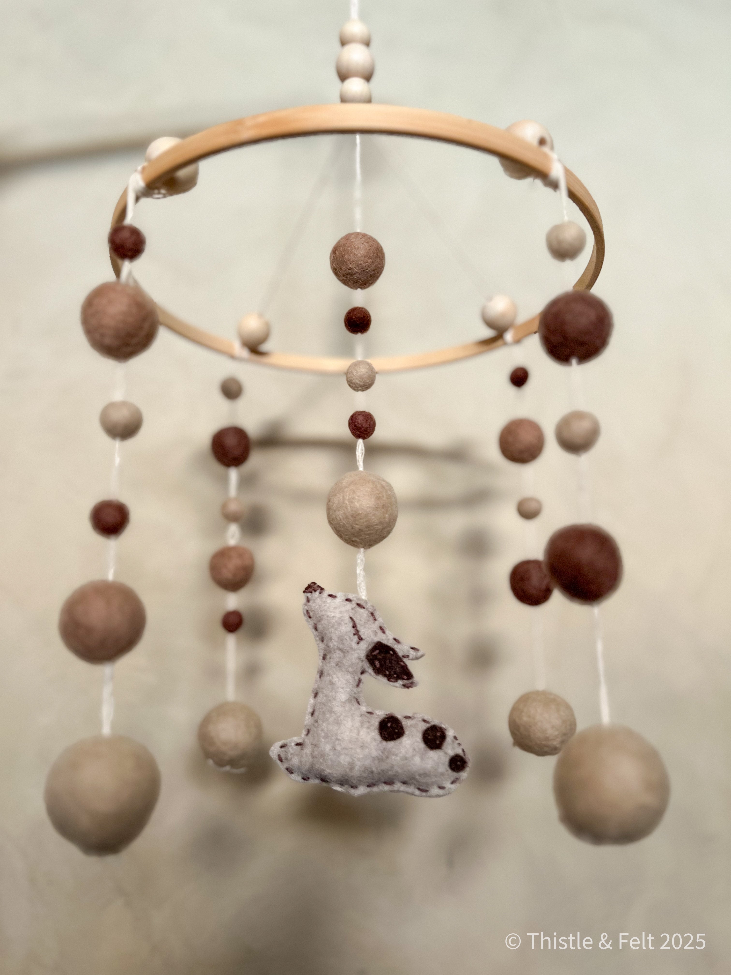 Sleeping fawn baby mobile made from pure wool felt with bamboo hoop and cotton twine, crafted for natural nurseries by Thistle & Felt