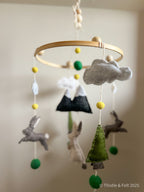 Where Bunnies Roam Mobile – handmade wool felt baby mobile featuring playful rabbits and natural tones, inspired by countryside meadows and crafted by Thistle & Felt.