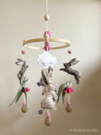 Handmade bunny felt nursery mobile with clouds by Thistle & Felt, perfect for natural nursery décor.